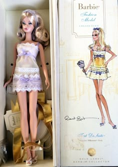 a barbie doll in a box next to a dress and shoes