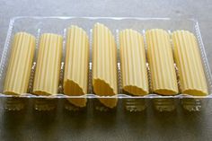 eight pieces of pasta in a plastic container