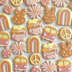 decorated cookies are arranged on a white surface