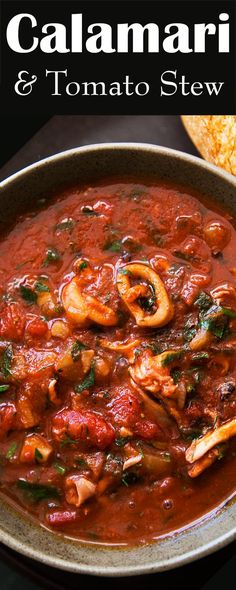 a bowl of tomato and mushroom stew with bread in the background, text overlay reads calamari & tomato stew