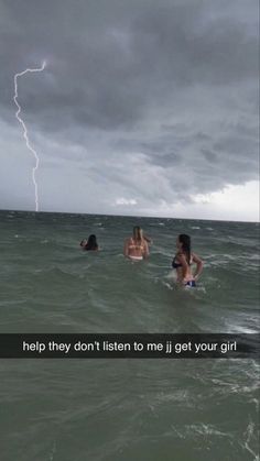 some people in the water and one has a lightning bolt