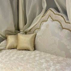 a close up of a pillow on a bed