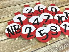 red and white numbers are arranged on wooden sticks with the number one to twenty in them