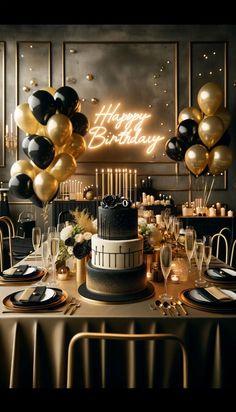 a black and gold birthday party with balloons, cake and champagne glasses on the table