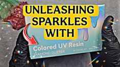 someone holding up a sign that says unleashing sparkles with colored uv resin