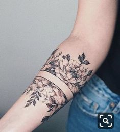 a woman's arm with flowers on it