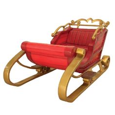 an old fashioned red and gold sleigh