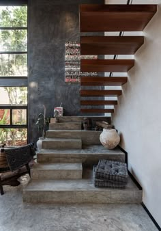 the stairs in this modern house are made of concrete