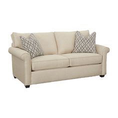 a white couch with two pillows on it