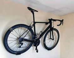 a bike mounted to the wall in a room