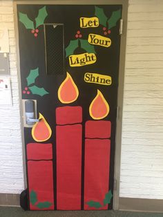 a christmas door decorated with candles and holly leaves, let your light shine on it