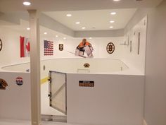 a hockey player is on the ice in an indoor rink with stickers all over it