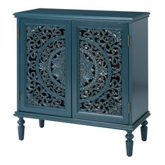 a blue cabinet with intricate carvings on the doors and drawers, it is isolated against a white background