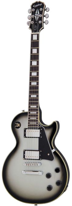 an electric guitar sitting on top of a white surface with black and silver trims