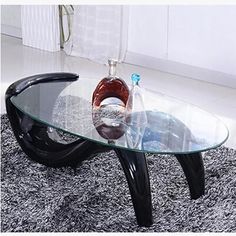 a glass table sitting on top of a shaggy rug