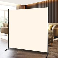 a large white screen in the middle of a living room