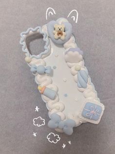 a cell phone case made to look like it has a teddy bear in the clouds