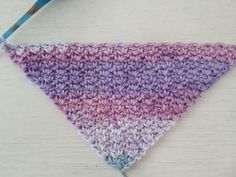 a crocheted triangle hanging from a hook