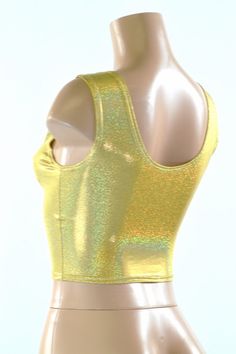 "This item is made to order, please read all the way through the listing before purchasing! Four way stretch lycra spandex in a gorgeous sparkling gold holographic! It features a low scoop neckline in front and back, and fits like a glove. TOP LENGTH: Underarm to hemline measures 8\" Womens Sizing (See below for instructions on where measurements should be taken) XXS: Bust 29\"-30\" / Waist 22\"-23\" / Hips 30\"-32\" Extra Small: Bust 31\"-32\" / Waist 24\"-25\" / Hips 33\"-35\" Small: Bust 33\" Cheap Fitted Gold Shirt, Metallic Fitted Tank Top For Night Out, Gold Stretch Tank Top For Night Out, Stretch Gold Tank Top For Night Out, Gold Fitted Disco Top, Metallic Shiny Fitted Crop Top, Fitted Metallic Shiny Crop Top, Gold Shimmer Stretch Tops, Metallic Fitted Disco Crop Top