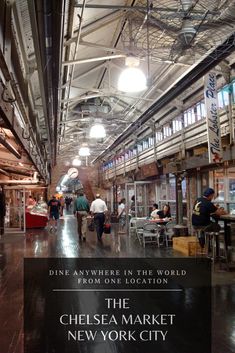 people are walking through an industrial building with signs on the walls and ceilings that read, dine anywhere in the world from one location