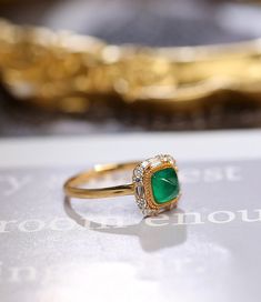 *Condition: Brand new *Center Stone: Natura Emerald from Zambia, approx 0.68ct, 6x6mm (IF clarity, 5A color) *Side Stone: Natural White Diamond, Round Cut & Baguette Cut (VS1 clarity and F color) *Gold Weight: 3.41g (depand the ring size) *Ring Dimension: approx 10x10x8.5mm *Metal Purity: Can be select Each piece is made-to-order with care and special attention to detail. all items are made with conflict-free diamonds and gems. Size: made to order The item will be gift wrapped and shipped. - Gold Baguette Cut Ring With Halo Setting, Gold Rings With Halo Setting In Baguette Cut, Elegant Moissanite Emerald Ring For Proposal, Yellow Gold Ring With Baguette Cut Halo Setting, Elegant 14k Gold Emerald Ring For Proposal, Elegant Proposal Emerald Ring With Brilliant Cut, Gold Emerald-cut Cluster Ring With Halo Design, Gold Emerald-cut Diamond Ring With Halo Design, Luxury Gold Emerald Round Ring