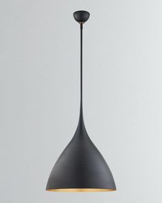 a black pendant light hanging from a ceiling