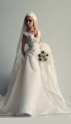 a barbie doll dressed in a white wedding gown