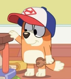 a cartoon dog wearing a baseball cap and standing in front of a pile of clothes