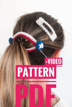 a girl with her hair in a pony tail bun and two beads on top of it