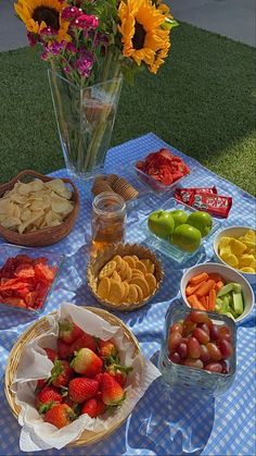 a table topped with lots of fruit and snacks