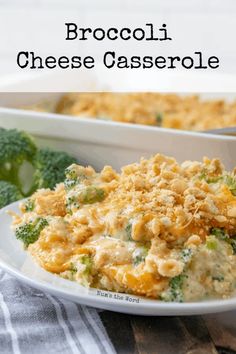 broccoli cheese casserole on a white plate with a serving dish in the background