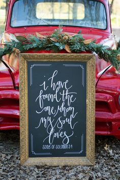 an old red truck is decorated with greenery and a sign that says i have found the one whom my son loves