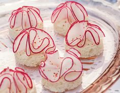 small desserts with red icing on a glass plate