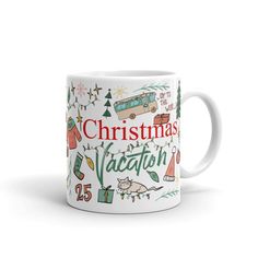 a white coffee mug with christmas vacation designs on the front and bottom, sitting in front of a white background