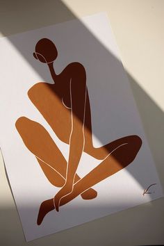 an image of a woman sitting on the floor with her legs crossed and holding a basketball