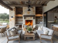 an outdoor living room with fireplace and furniture