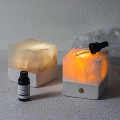 two different types of salt lamps with one light turned on and the other turned off