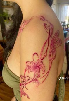 a woman with a tattoo on her arm has a butterfly and flower design on it