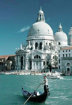 a gondola in front of a large white building