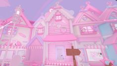 a pink house with lots of windows and decorations on the outside, in front of a rainbow colored sky