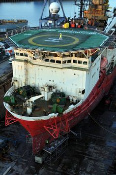 a large ship sitting in the middle of a body of water