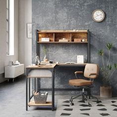 an office with a desk, chair and clock on the wall next to potted plants