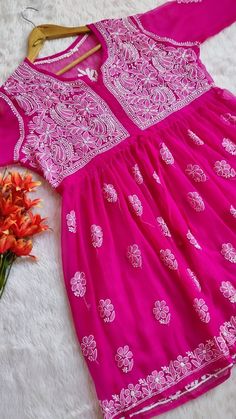 Kurti Fabric : Georgette Sleeves : 3/4 Sleeves Style : Peplum Top Kurti Length : 30-32 inches Occasions : Casual Wear, Office Wear, Festive Wear Garment Care : Hand Wash Only Price Includes : Kurti, Sharara with inner Note : Embroidery may be little vary due to vary human hand involvement. Pink Resham Embroidery Kaftan For Festivals, Pink Resham Embroidery Kaftan For Diwali, Pink Anarkali Kaftan For Navratri, Pink Anarkali Kaftan For Festive Occasions, Traditional Pink Georgette Kaftan, Pink Anarkali Kaftan For Festivals, Spring Festive Traditional Wear With Cutdana, Traditional Festive Pink Kaftan, Spring Festive Kurta With Cutdana Detail