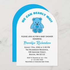 a baby shower with a blue teddy bear on it