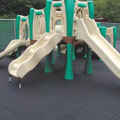 a playground with several slides in the middle