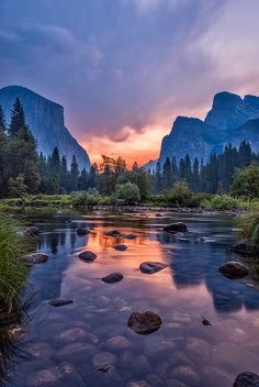 the sun is setting in yose peak, yose river and mountains are reflected in the water