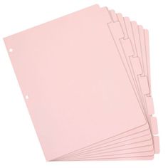 six pink paper sheets stacked on top of each other with holes in the middle for cutting