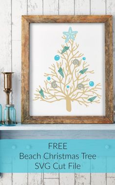 a framed christmas tree with blue ornaments on it