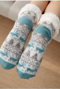 Walking in the Winter Wonderland or even just on your cold floors in the winter; these knitted slipper socks will keep your feet nice and cozy on those cold winter days and nights. Featuring a with faux fur lining and a rubber sole design on the bottom to prevent slipping when walking these are sure to be a new favorite part of your lounge wear. Made with a polyester and cotton blend. Comes in 21 fun patterns from which to choose. Halloween Knit, Blue Zone, Halloween Wigs, Soft Sock, Halloween Sweater, Cozy Holiday, Black Heel Boots, Winter Socks, Thick Socks