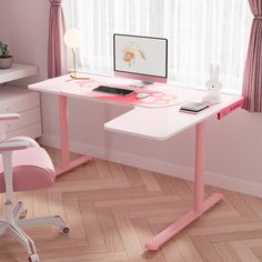 a pink desk with a computer on it